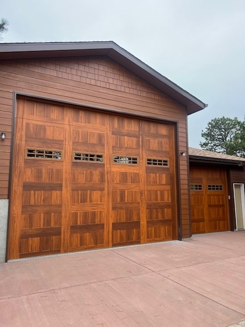 Wood-look garage door with windows